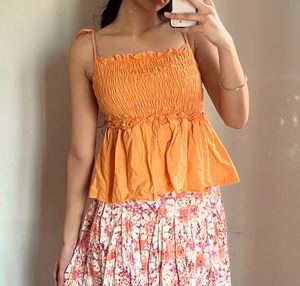 Orange Smocked Peplum Top