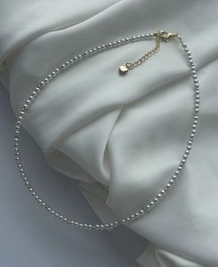 Delicate Pearl Necklace with Gold Accent