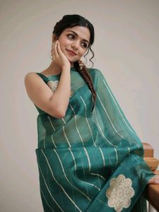 Elegant Green Saree with Floral Motifs