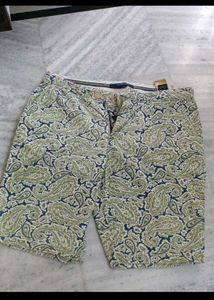 slightly torn shorts with brand