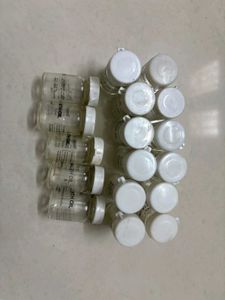 Lot of 17 Small Glass Bottles with Caps