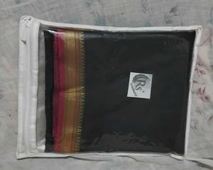 Elegant Black Saree with Gold Border
