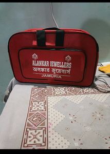 Red Alankar Jewellers Travel Bag