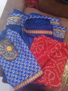 1) Royal Blue Lehenga Choli with Red Dupatta.  2)