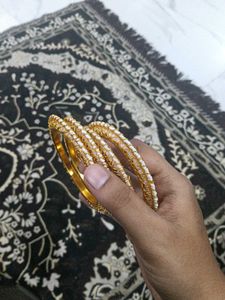 Elegant Gold and Pearl Bangles