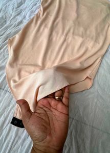 Sleek Peach Bodysuit