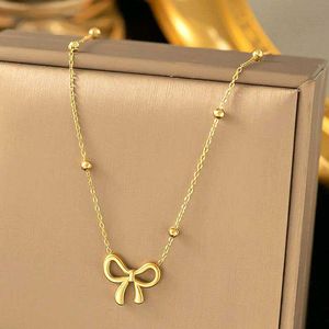 Gold Bow Pendant Necklace