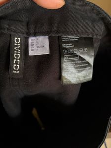 H&amp;M Classic Black A-Line Button-Front Denim Skirt