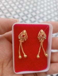 Elegant Gold Tone Earrings with Red Stones