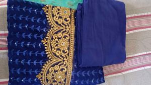 Embroidered Blue designer saree with matching Peti