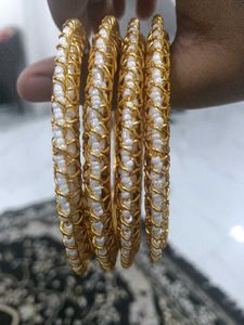Elegant Gold and Pearl Bangles