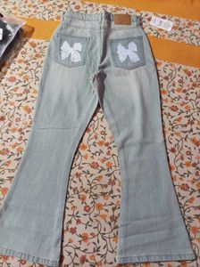 Light Wash Flare Jeans with Bow Detail