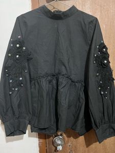 Chic Black Peplum Top with Embellishments