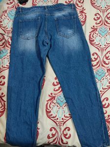 Distressed Blue Denim Jeans