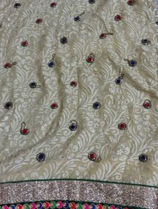 Elegant Beige Embroidered Saree