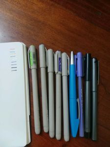 Assorted Pens and Notebook
