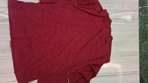 It's New Unused Maroon Coloured T Shirt.