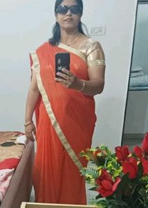 Vibrant Orange Saree with Golden Border