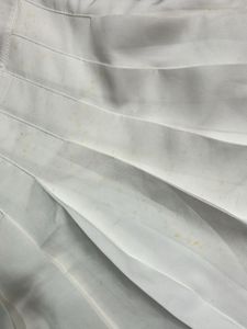 white mini pleated skirt