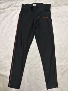 Nike Black Athletic Pants with Orange Stripe