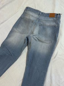 Distressed Blue Denim Jeans
