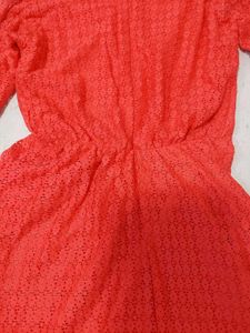 Elegant Coral Lace Gown with Embellished Neckline