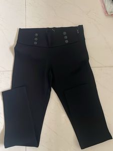 High-Waisted Black Pants with Button Detail
