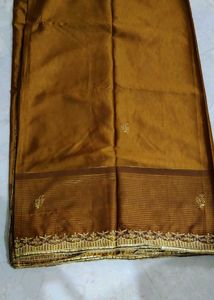 Elegant Brown Striped Saree with Gold Embroidery