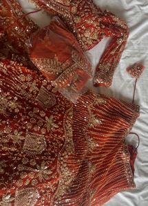 Stunning Orange Embellished Lehenga Choli