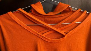 Orange Cut-Out Turtleneck Top
