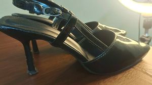 Black pointed heels with adjustable band