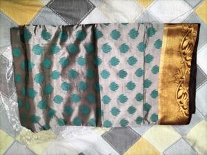 Elegant Silk Saree with Teal Motifs