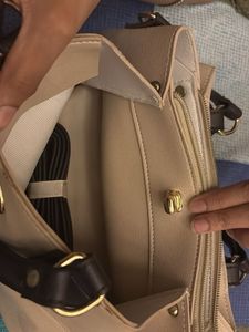 Elegant Beige Handbag with Black Handles