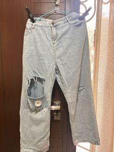 Ripped Wide Leg Jeans with Daisy Patch