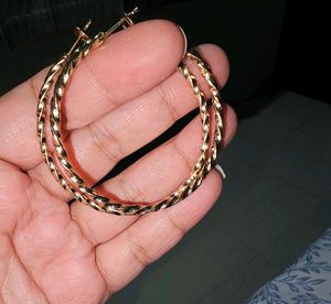 Gold Tone Twisted shiny Hoop Earrings