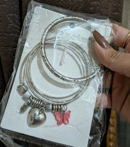 Pretty bangle set with cute charms.