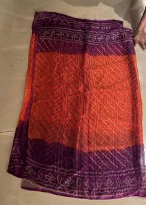 Lovely orange and purple bandhej Saree