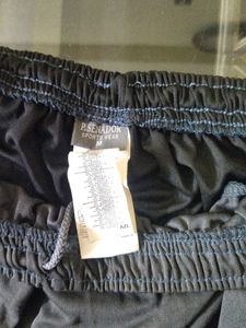 Tonal black side stripe shorts.