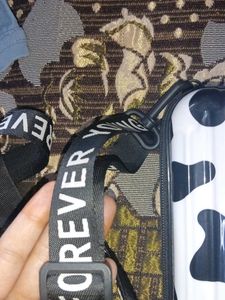 a sling bad in black or white colour