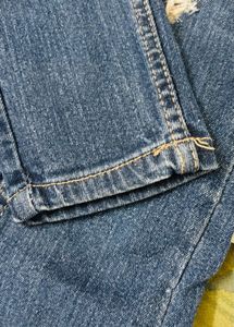 Ripped Blue Denim Jeans