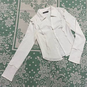 White Ruffled Button-Up Shirt