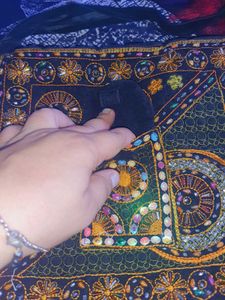 Black color embroided and studded sling bag