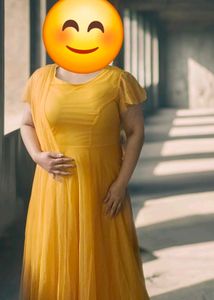 Beautiful Yellow Partywear Gown With Net Pallu