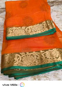 Vibrant Orange Saree with Gold Border