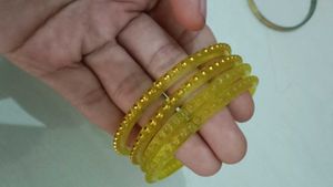 Elegant Yellow Bangles with Golden Embellishments