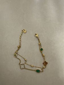 Elegant Gold Bracelet with Emerald Accents