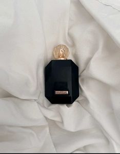 Revolution  Perfume Bottle,HALF USED,FIXED PRICE