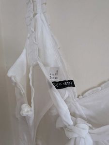 White mini tie back dress