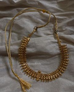 Elegant Gold Tone Necklace with Tassel
