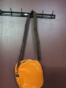 Orange "carry-on cool" crossbody bag